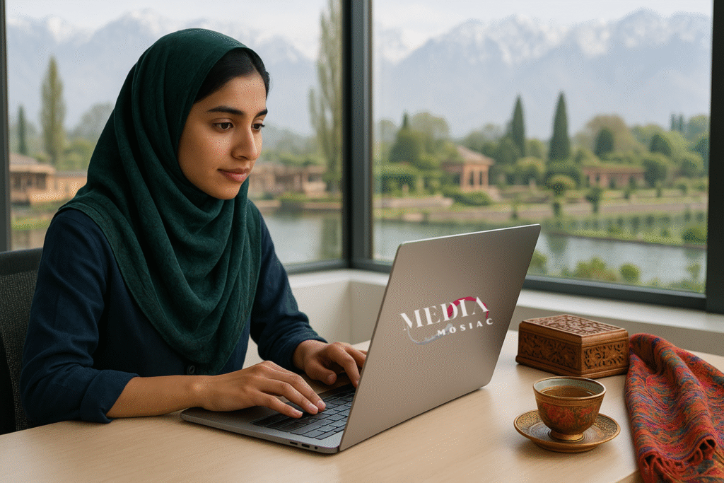 Kashmiri entrepreneur working on a laptop displaying the “Media Mosiac” homepage, with Srinagar landmarks like Dal Lake and snow-covered mountains visible in the background; modern workspace with subtle traditional Kashmiri elements like kahwa and walnut wood decor.